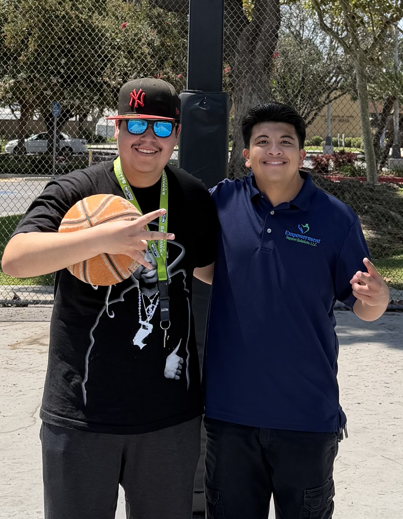 Participant and support professional enjoying basketball in the community