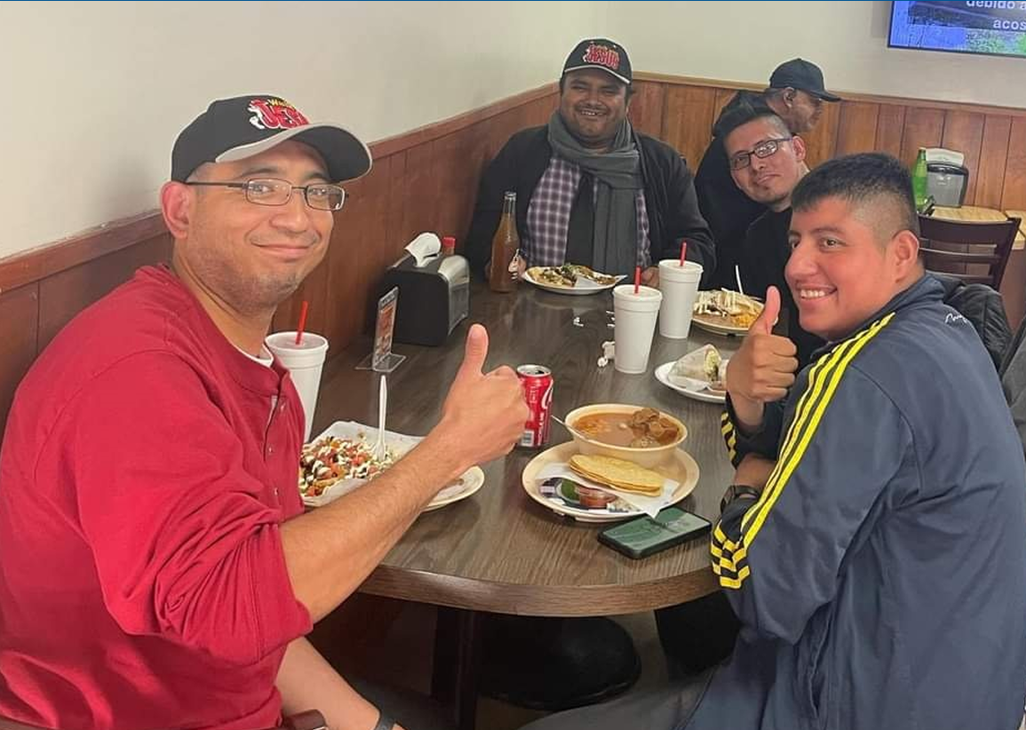 Participants and staff sharing a meal